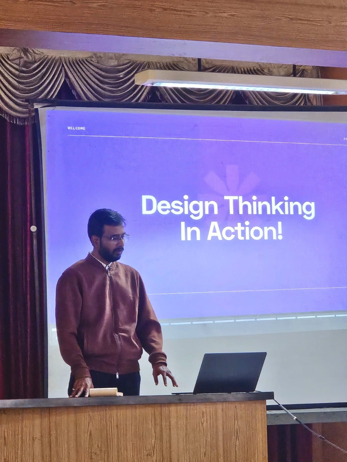 Vishal Jadhav delivering a Design Thinking in Action talk to an audience