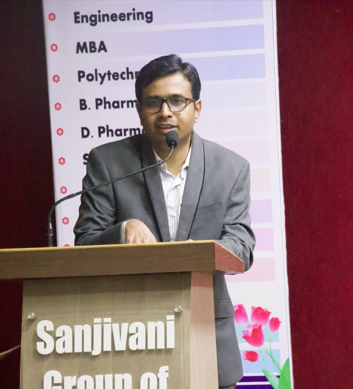 Speaking at a podium