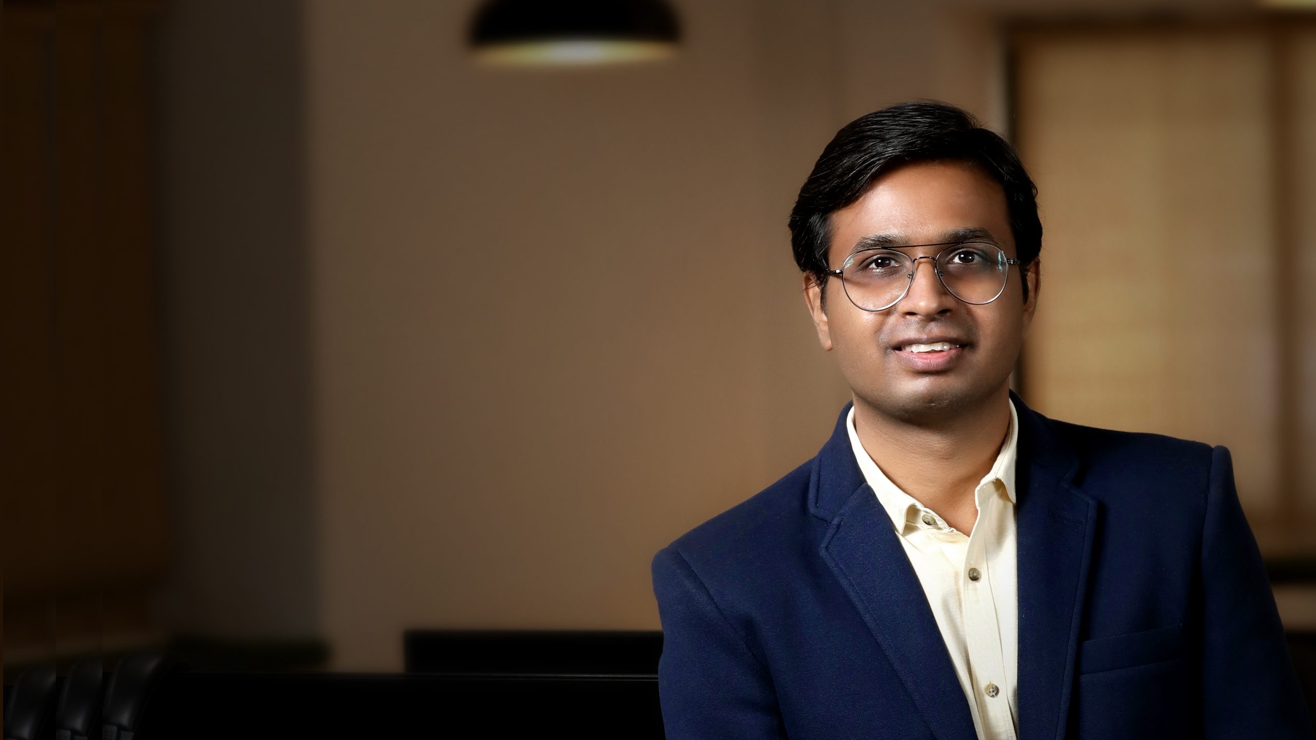 Vishal Jadhav, Founder and Director of UX Strategy at Prismic Reflections, in his design studio